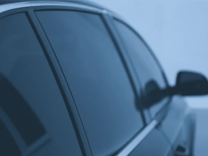 Close-up of carbon window tint film on car window