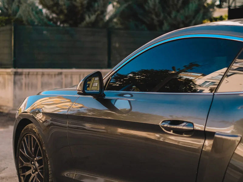 Car with nano-ceramic window tint film installed